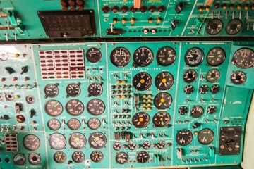  old aircraft dashboard with a variety of sensors and switches