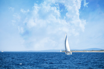 Fototapeta na wymiar luxury big white sailing yachts at the sea 