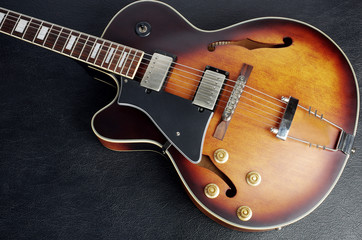Obraz na płótnie Canvas Jazz guitar on a dark background. Close-up