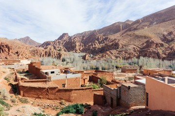 Berber village in mountains. Morocco tourism: trekking man in mountains. Atlas mountains, Jebel...