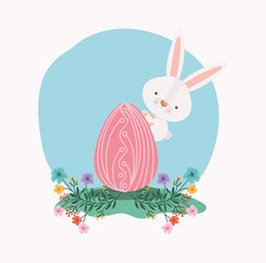 cute rabbit with egg painted and flowers in the garden