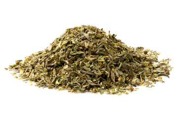 A pile of dried chopped provence herbs isolated on white.