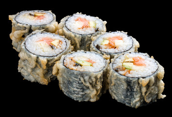 Roll tempura with salmon and vegetables on black background