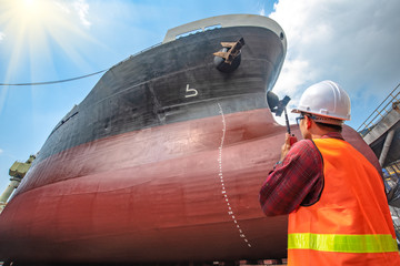 supervisor, foreman, inspector, surveyor takes final inspection of the cleaning, repairing,...