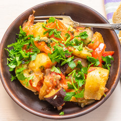 Roast vegetables on a rustic plate closeup - a healthy organic dish
