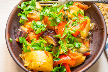 Roast vegetables on a rustic plate closeup - a healthy organic dish