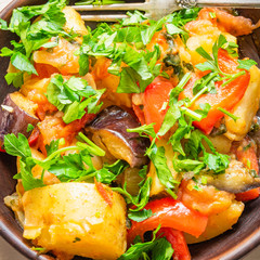 Roast vegetables on a rustic plate closeup - a healthy organic dish