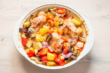 Homemade chicken stew with vegetables in a large pot - healthy organic food.