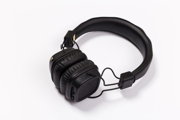 Black headphones on white background