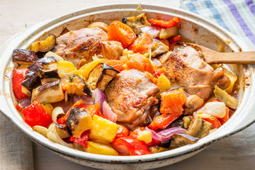 Homemade chicken stew with vegetables in a large pot - healthy organic food.