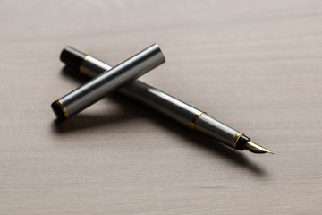 Black fountain pen on table
