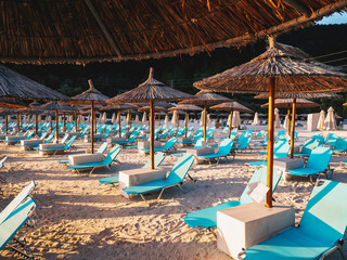 Chairs and umbrellas at Porto Vathy Marble Beach in Thasos, Greece