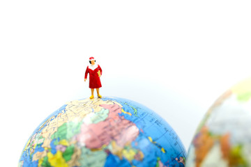 Miniature people : Group of Women Teamwork Happiness with world map using for concept of International women day.