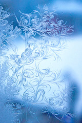 Winter pattern on glass. Frost. Winter draws patterns. Frosted window