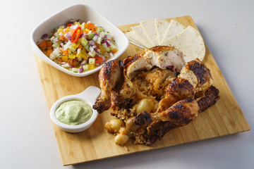 roasted whole chicken rice inside with mexican salad pita and avocado dip