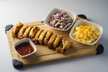 bite marinated fried pork ribs in batter dipped in tomato sauce