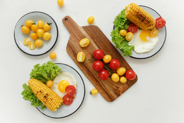 cherry tomatoes, eggs, corn and vegetablesv