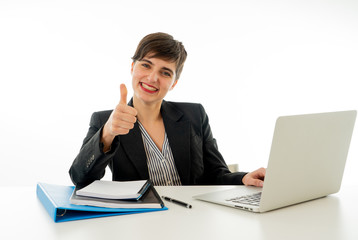 Portrait of happy attractive young businesswoman on laptop looking confident with thumb up