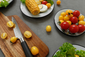 Obraz na płótnie Canvas cherry tomatoes, eggs, corn and vegetablesv