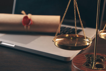 justice and law concept. Lawyer workplace with laptop and documents with dark wooden. Notary's...