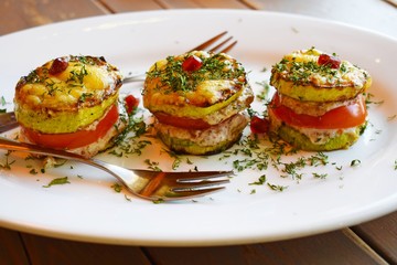 Vegetarian appetizer of fried vegetables with sauce close-up vertically.