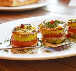 Vegetarian appetizer of fried vegetables with sauce close-up vertically.