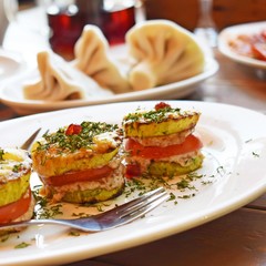 Vegetarian appetizer of fried vegetables with sauce close-up vertically.