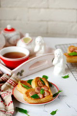 Puffs with sausages in heart shapes. Valentine's Day Breakfast