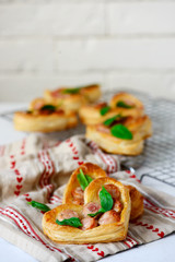 Puffs with sausages in heart shapes. Valentine's Day Breakfast