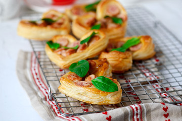Puffs with sausages in heart shapes. Valentine's Day Breakfast