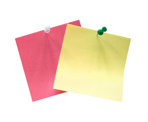 yellow and pink sheets of paper fastened with buttons. isolated image