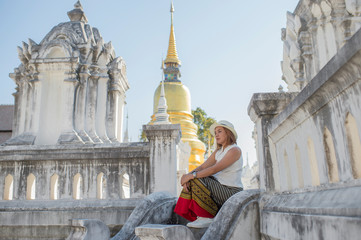 Traveller girl walking in the temple,Wat Suan Dok,Chiang Mai,Thailand