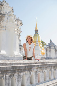 Traveller girl enjoying and looking at Buddhist stupas,Wat Suan Dok,Chiangmai,Thailand