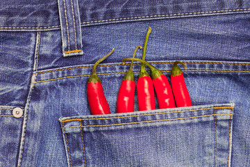 red peppers in a jeans pocket