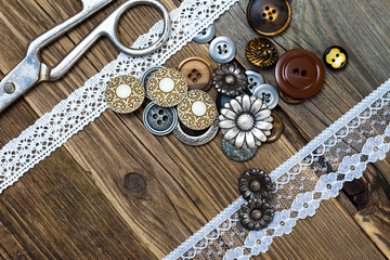 vintage buttons, lace, and a dressmaker scissors