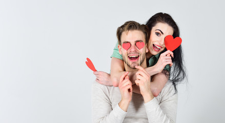 Valentines day and love. Romantic ideas celebrate valentines day. Man and woman couple in love hold red heart valentines cards white background. Man and pretty girl in love. Valentines day concept