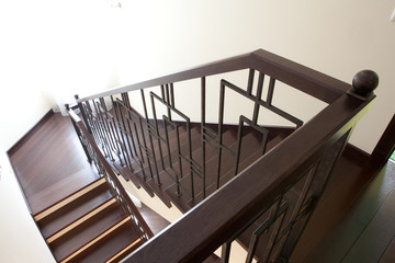 Modern brown oak wooden stairs, view from top, classic home style beauty