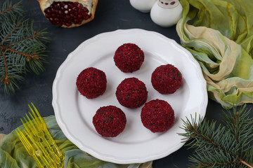 Traditional Georgian appetizer pkhali from beet, walnuts and pomegranate