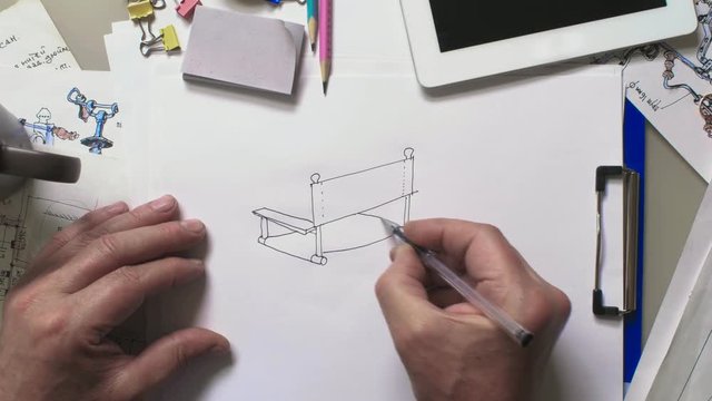 Artist is drawning chair with the inscription you