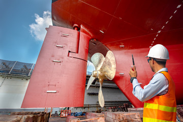 supervisor, foreman, inspector, surveyor takes final inspection of the cleaning, repairing,...