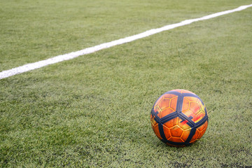 Soccer ball on grass football field