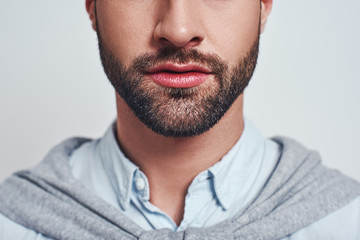 Perfect beard. Close-up cropped image of a handsome young man with a beard - obrazy, fototapety, plakaty