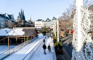 Cologne, Germany - wintertime in the Old Town. In this fairy-tale atmosphere, a unique skating rink...