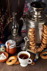 Obraz na płótnie Canvas Russian Tea Party including black tea from samovar, lump sugar, bagels sushki and baranki