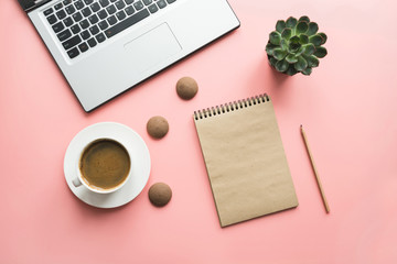 Workspace with open laptop, documentation, and cup of black coffee. Top view with copy space. Office business concept. Working process. Flat lay slyle.