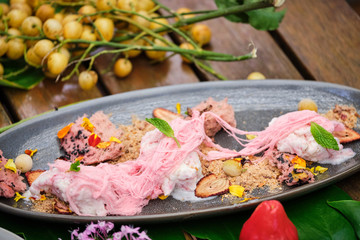 Fototapeta na wymiar Tropical fruit platter with fruit, meat, seafood, ice cream, fresh food