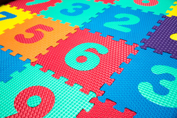 Colorful Baby Mat. Rubber foam pad for children playing. Colorful background ackground with digits - 248841031