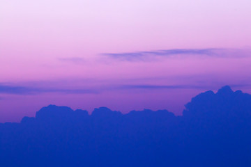 Beautiful purple-pink sky at sunset with a line of clouds