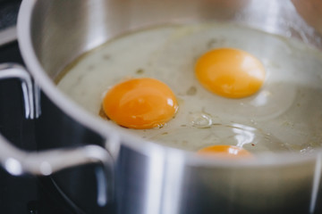 Close-up of fried eggs in pot