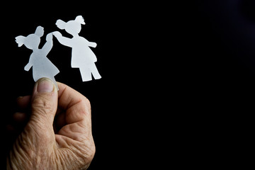 Illustration of two girlfriends sisters in the hand of an old grandmother